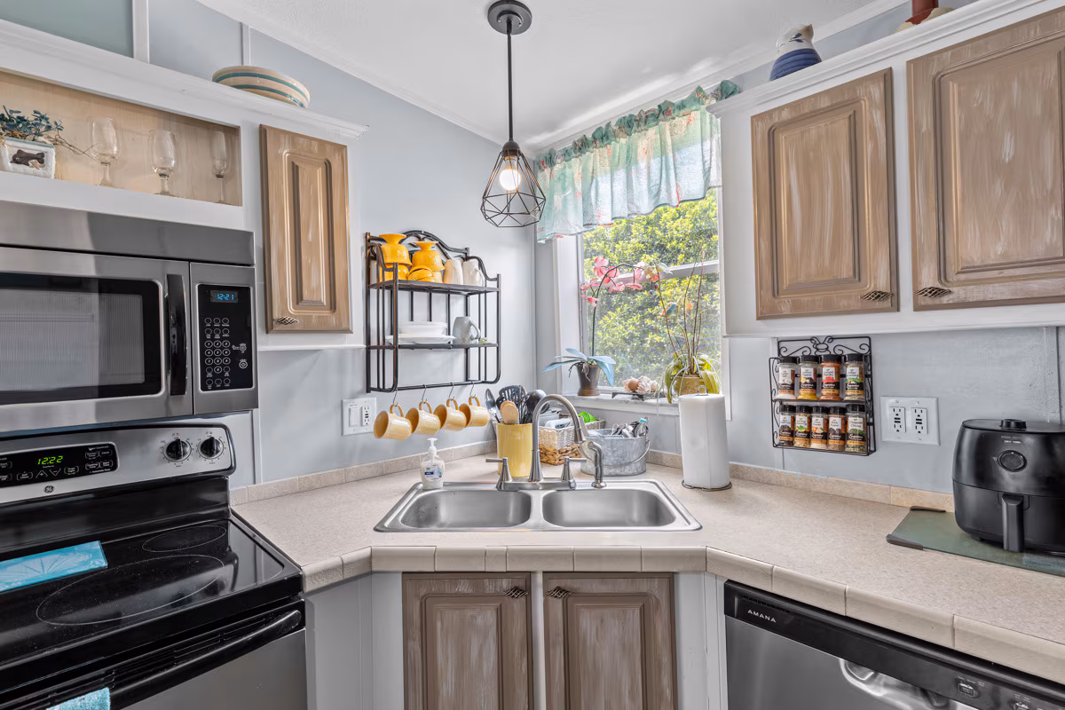 Full kitchen with cooking tools and breakfast bar